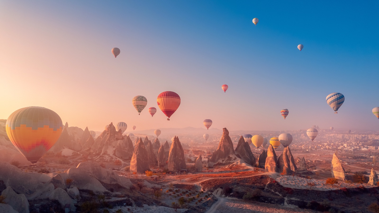 Cappadocia breakfast with hot air balloons at sunrise